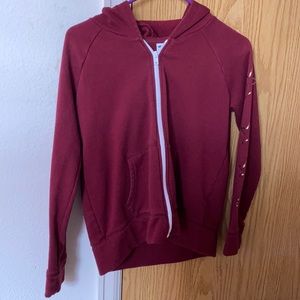 Burgundy zipper sweater with stars on sleeves